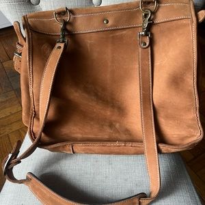 The Territory Ahead tan suede messenger saddle bag. Used but in great condition.